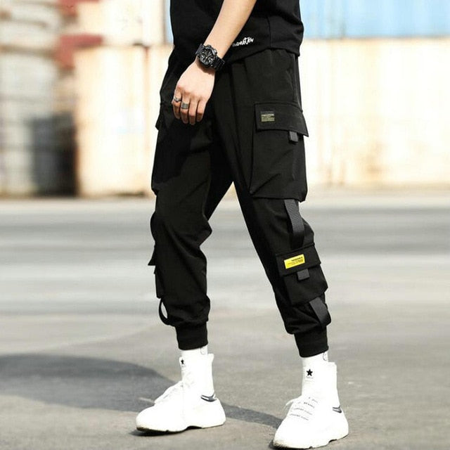 Streetwear Hip Hop negro Harem pantalones hombres cintura elástica Punk pantalones con cintas Casual Slim Jogger pantalones de hombres pantalones de Hip Hop